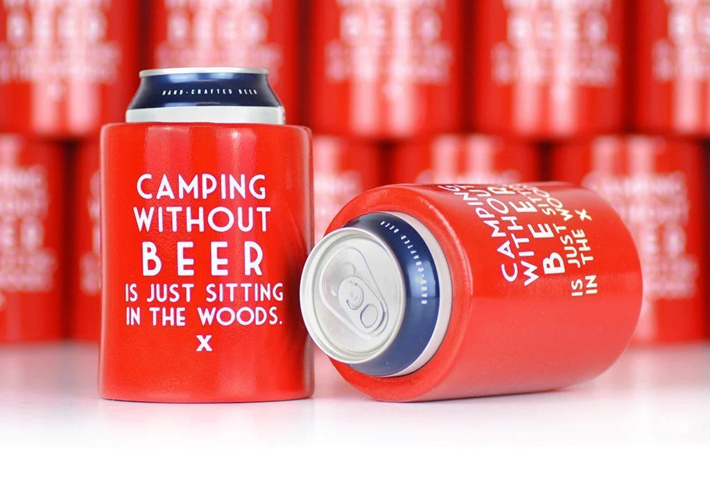 A Red, thick koozie with the words, "Without Beer, camping is just sitting in the woods"