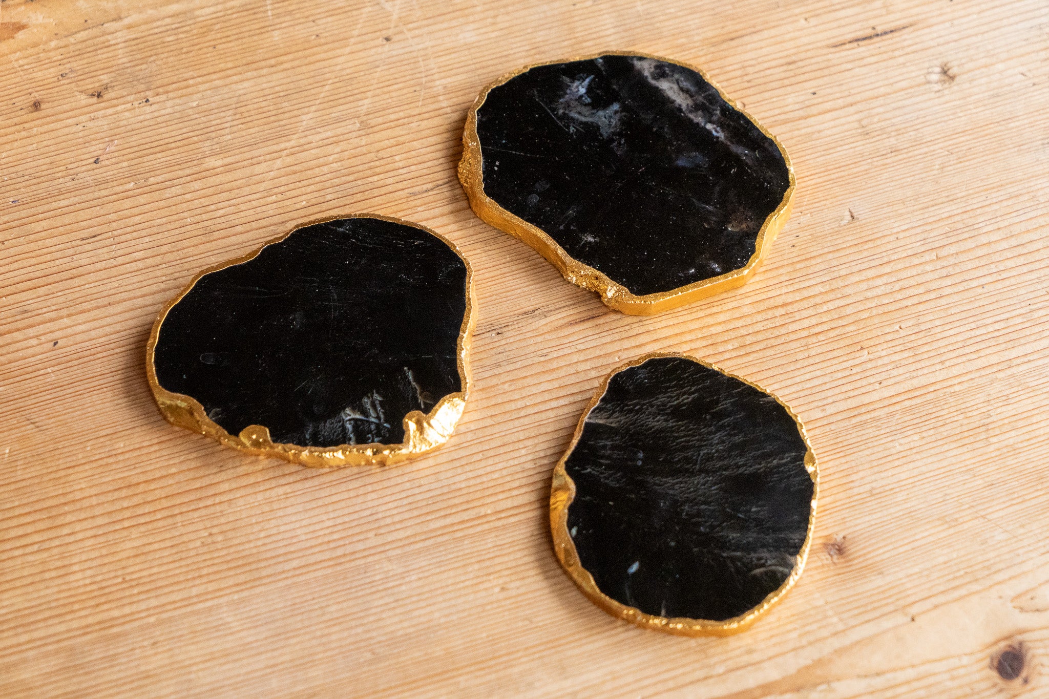 Sleek Black Agate Coasters Rimmed in Radiant Gold