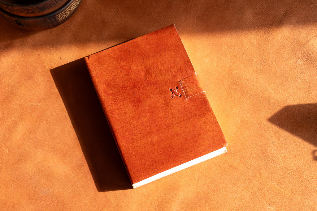 The Artisan's Leather Journal with a Stitch Strap Closure