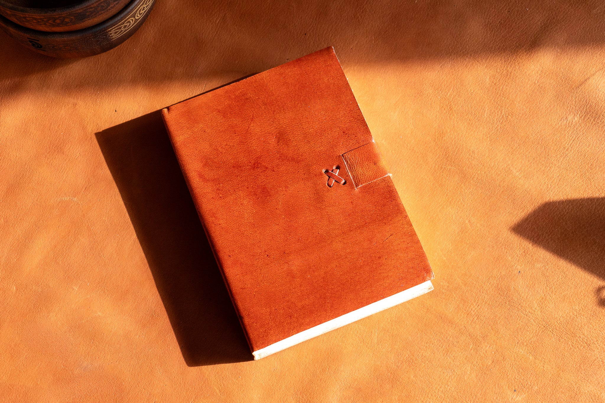 The Artisan's Leather Journal with a Stitch Strap Closure